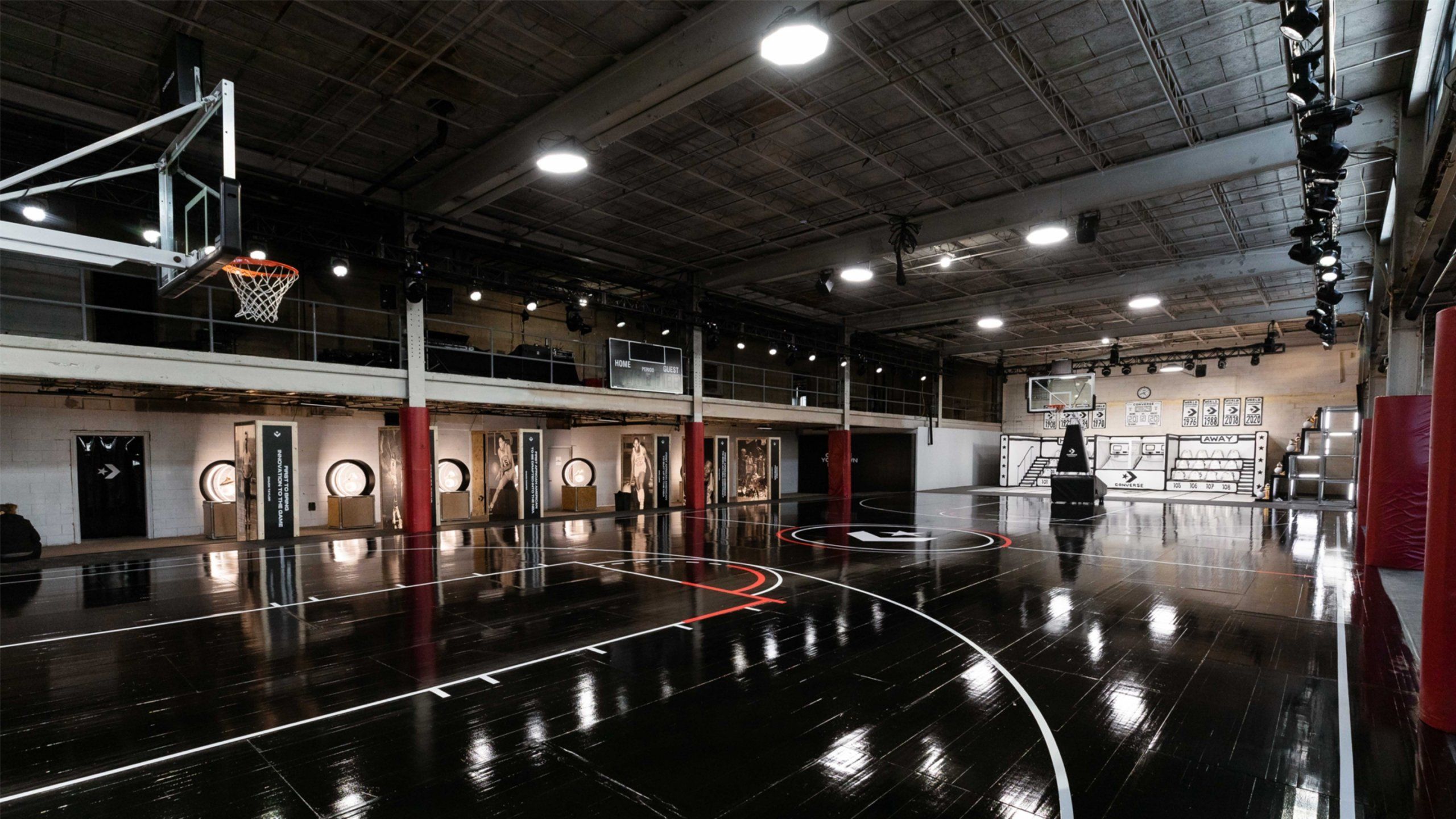 Converse basketball court with indoor lights, black floor and Converse logo center court