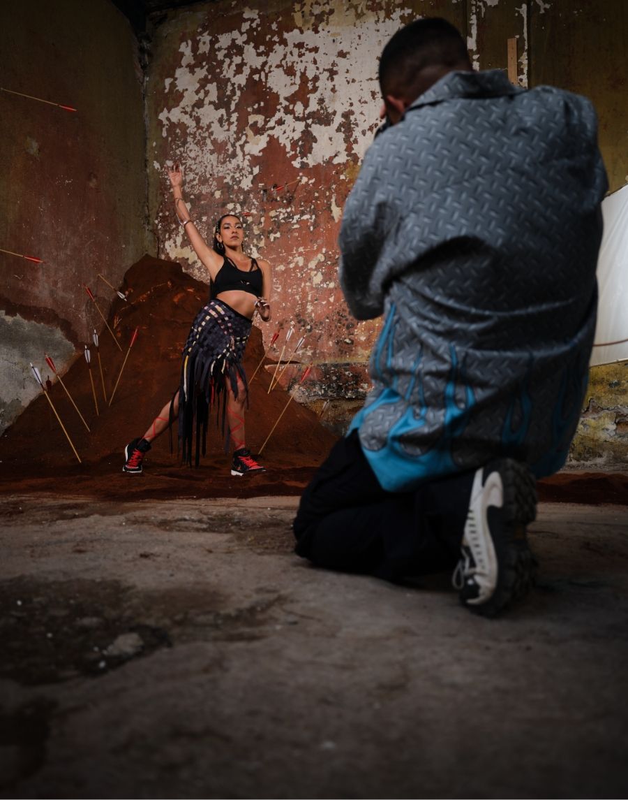 Behind the scenes shot of woman being photographed
