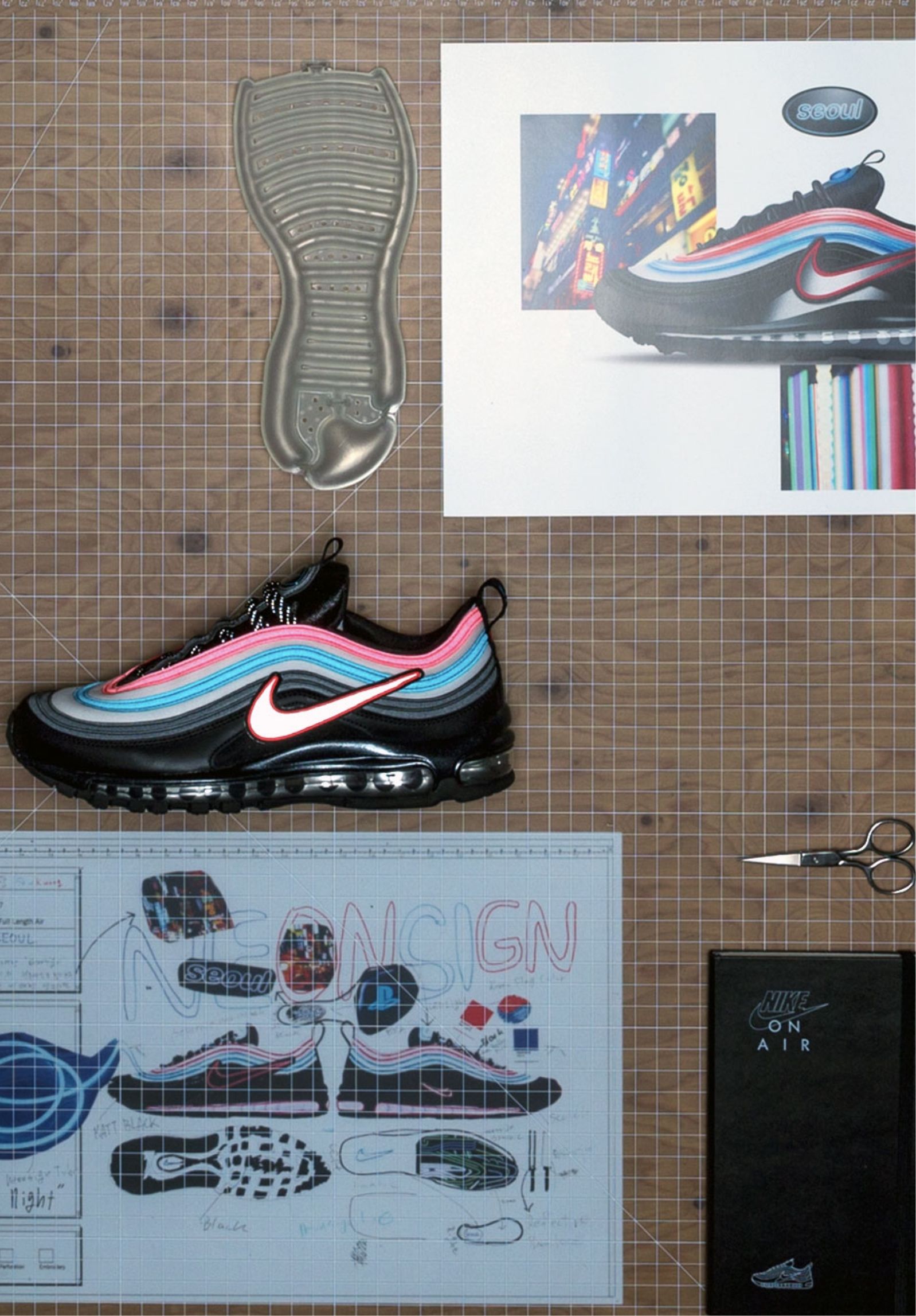 Air Max 97 Neon Seoul design sketches and final product on table