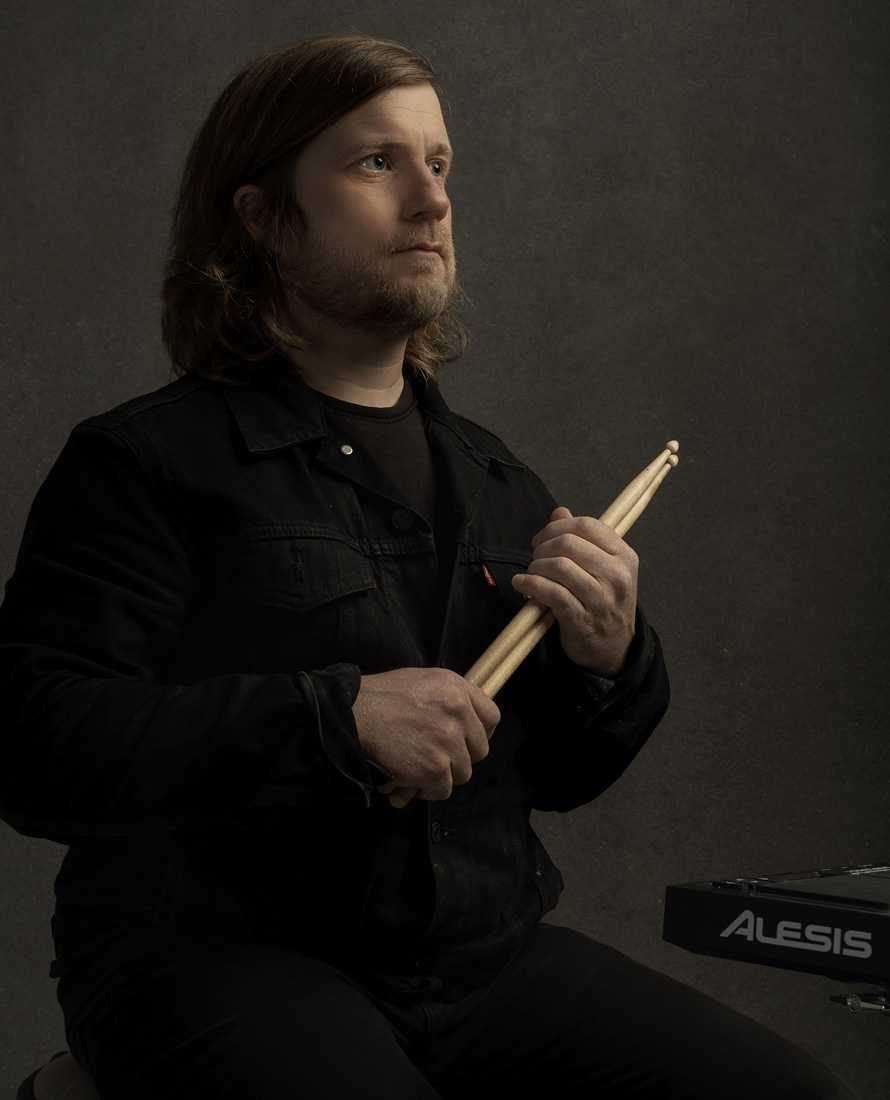 Bryan holding drum sticks