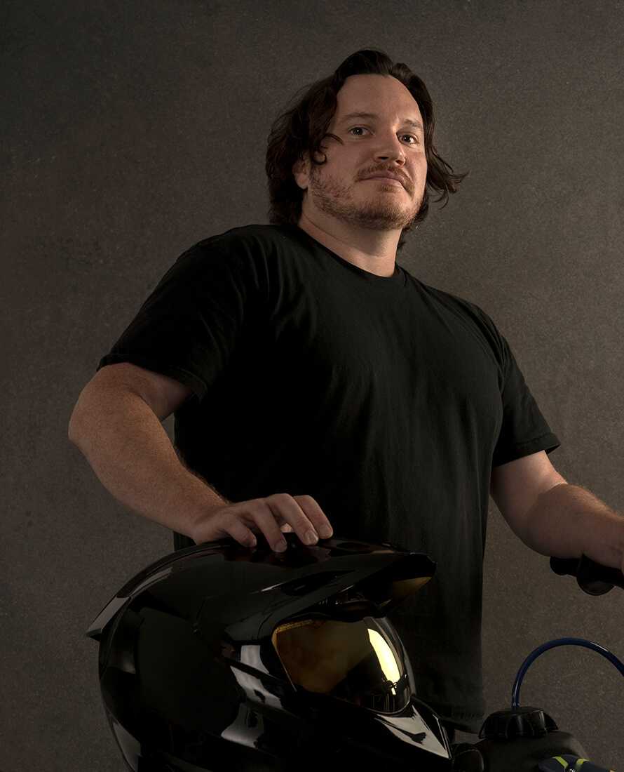 Robb Hunter with motorcycle and motorcycle helmet