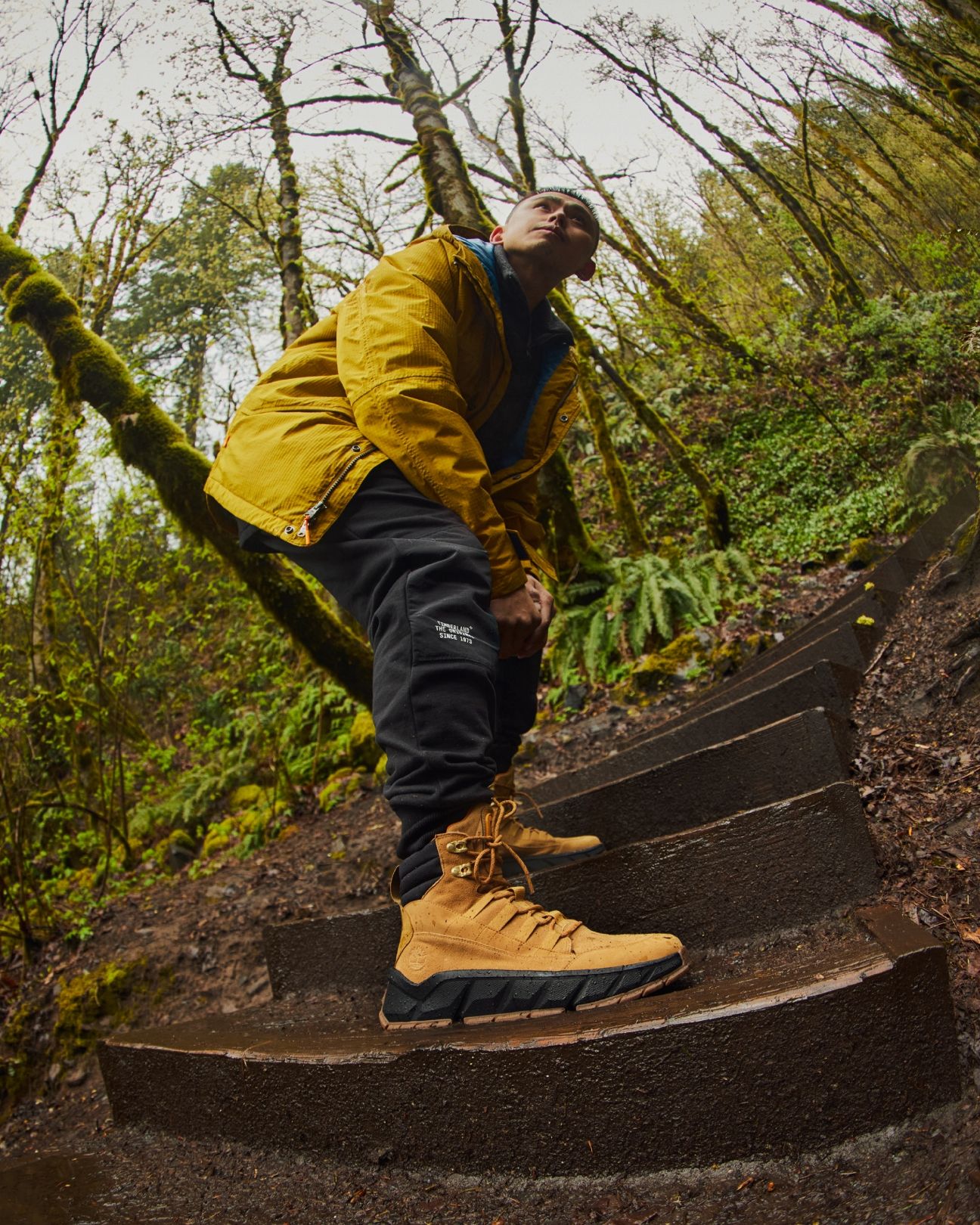 Marc on trail stairs with timberland boots and jacket.