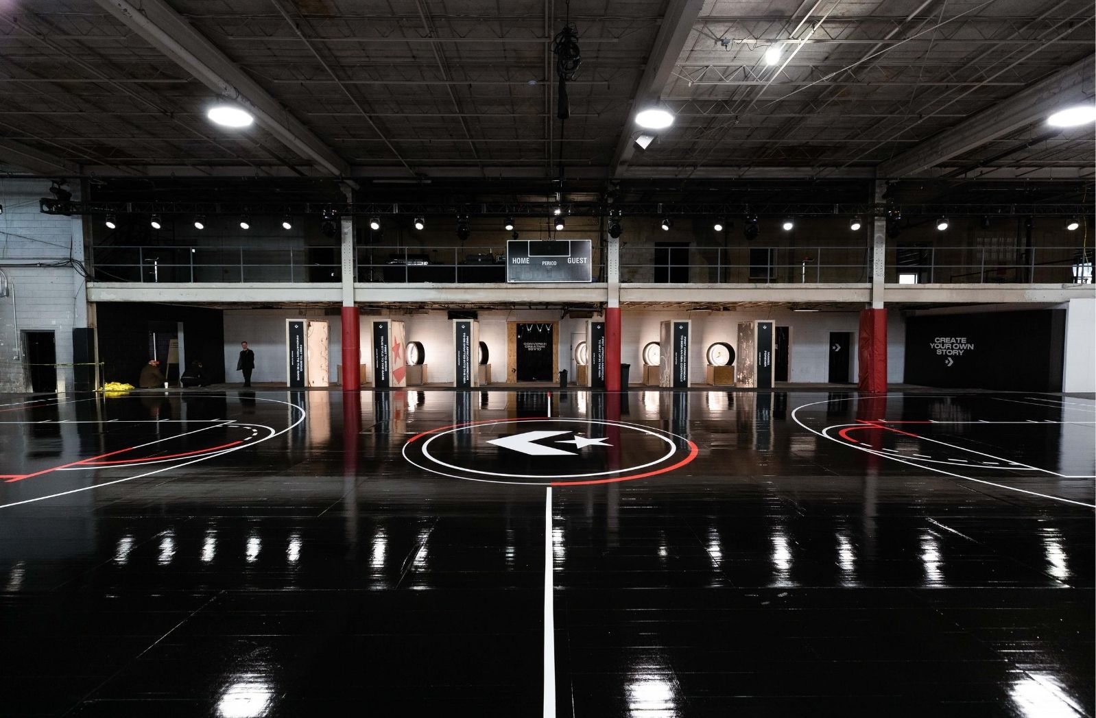 Basketball Court with black painted floor and Converse Logo center court