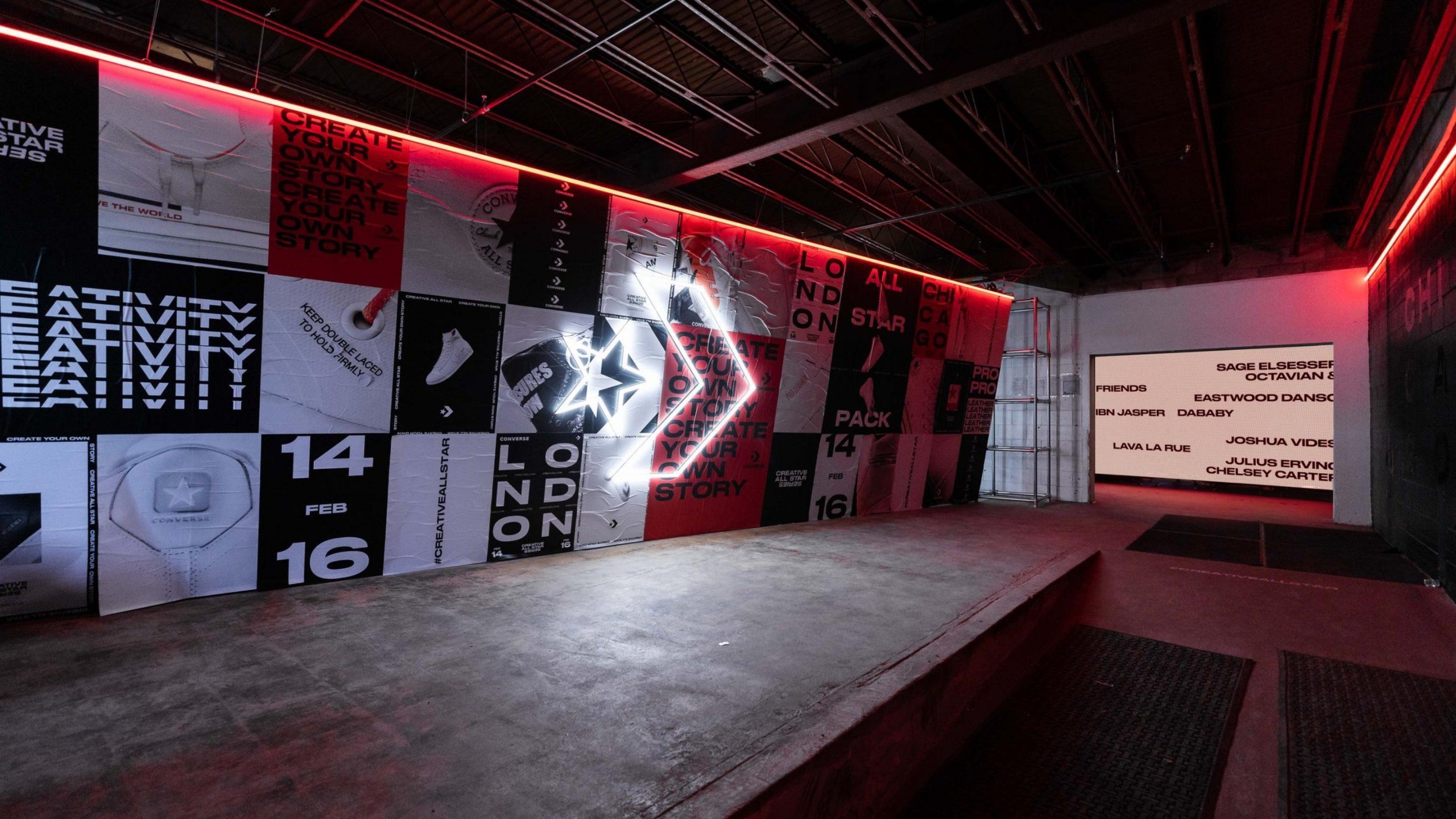 Converse Event space with posters covering wall and neon Converse Logo sign