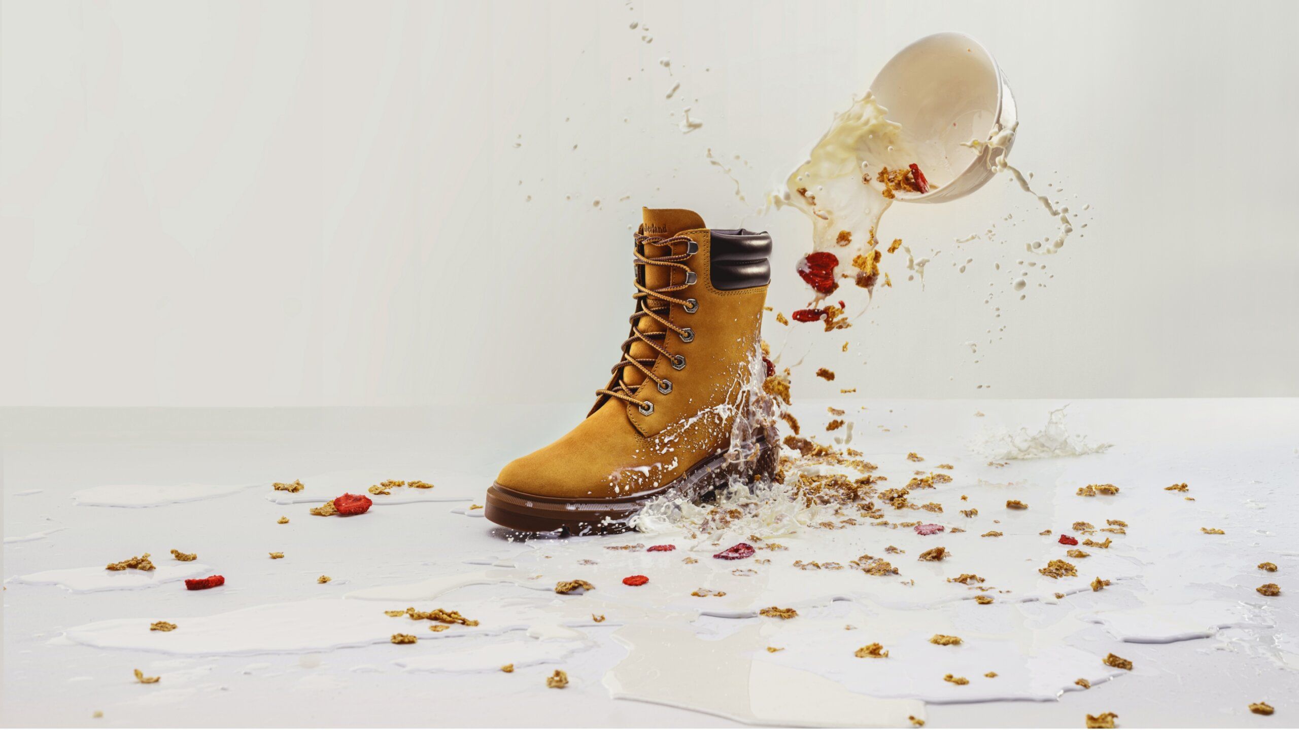 Timberland boot with bowl of cereal falling and spilling over onto boot