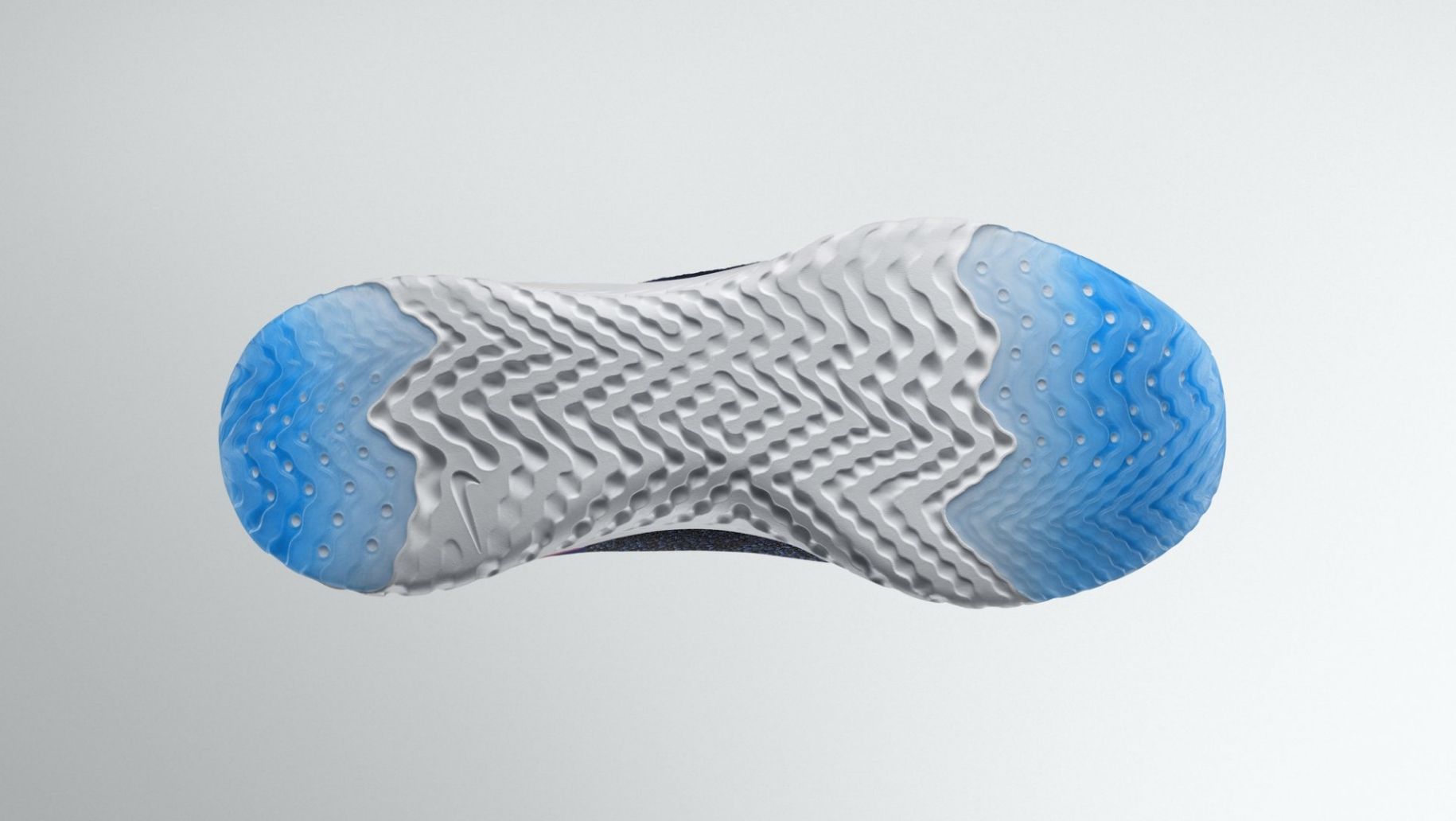 Nike Epic running shoe sole bottom view showing air pockets at heel and toe