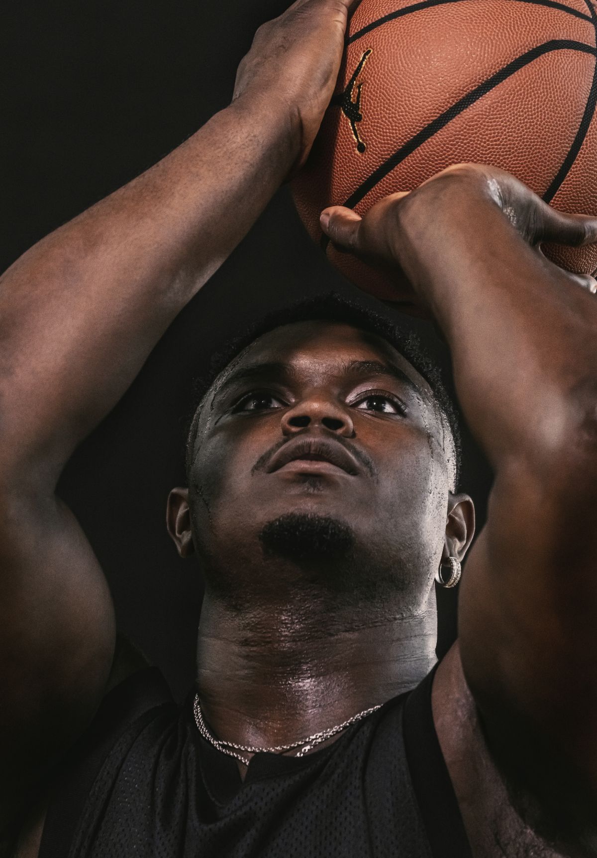 Close up of Zion's face as he sets up to shoot basketball